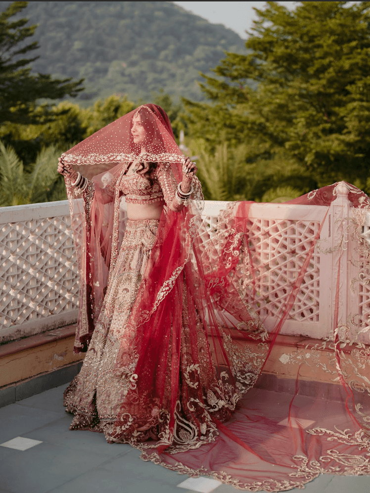 Image may contain Clothing Dress Fashion Formal Wear Gown Wedding Wedding Gown Adult and Person