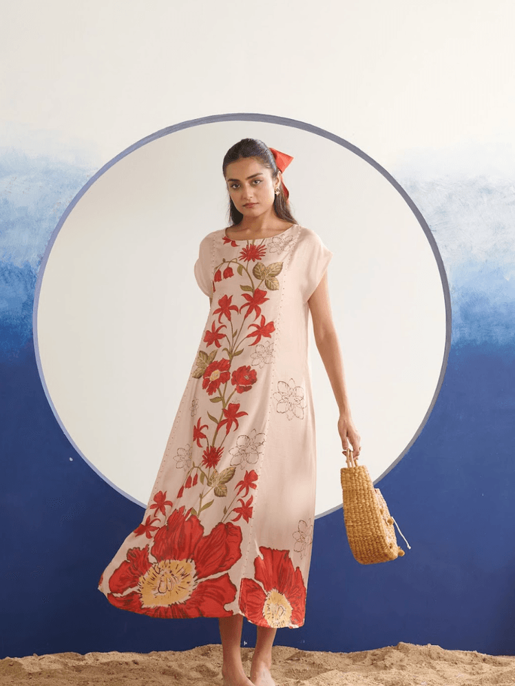 Image may contain Elsa Firouz Azar Beachwear Clothing Adult Person Dress Sleeve Accessories Bag and Handbag